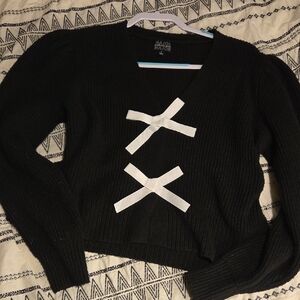 Elegant Black V-Neck Sweater with White Accents